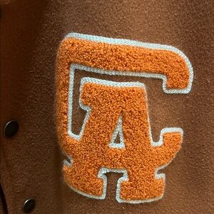 Brown Jacket with Orange Lettering CA